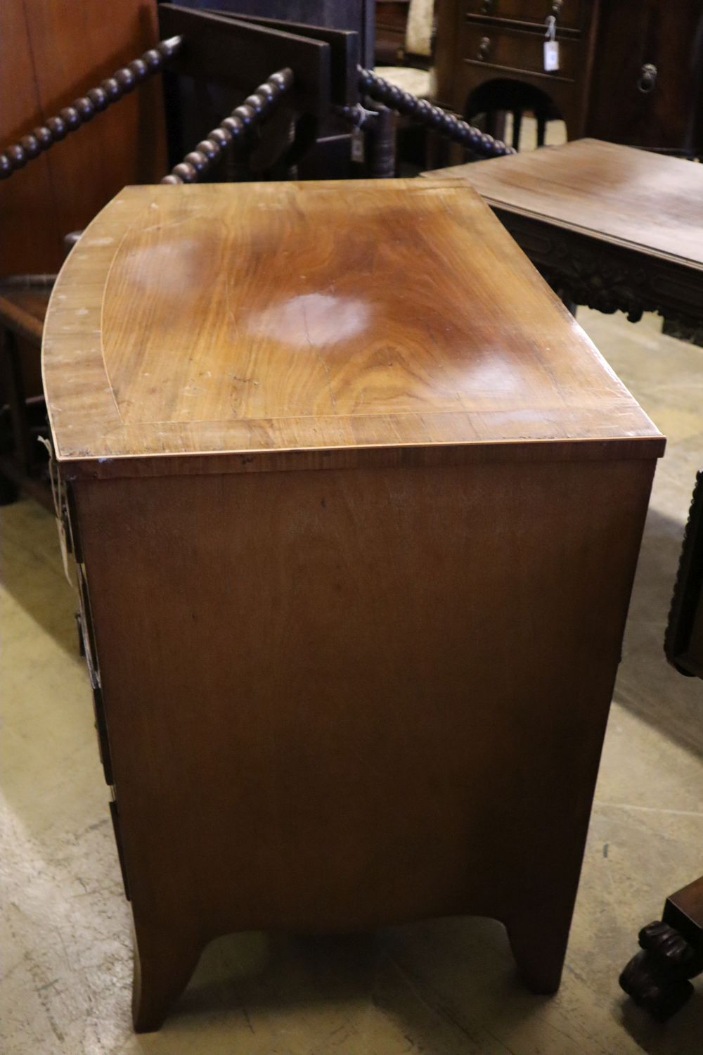 A 19th century banded and inlaid mahogany bow-fronted chest fitted four graduated long drawers, width 86cm depth 56cm height 76cm